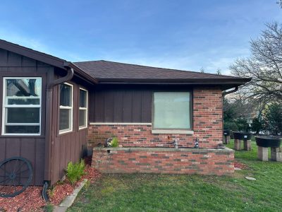 east peoria gutter cover installation - outdoor front view of brick house with brown gutters, before