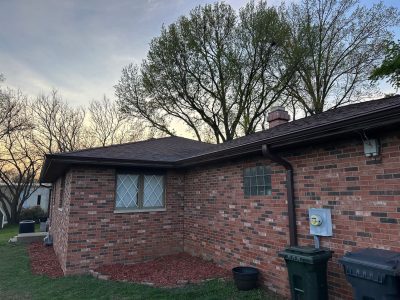 east peoria gutter cover installation - outdoor backyard view of brick house with brown gutters, before