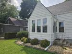 moline window replacement - outside front view of white house with new windows, after