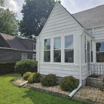 moline window replacement - outside front view of white house with new windows, after