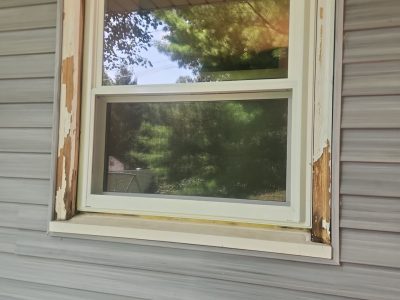 Rock Island Window Installation - chipped outside window, before