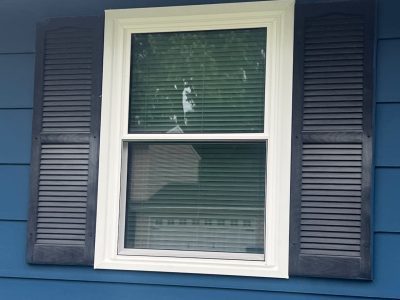 East Moline Window Installation - outside view Double-Hung window with shutters, after