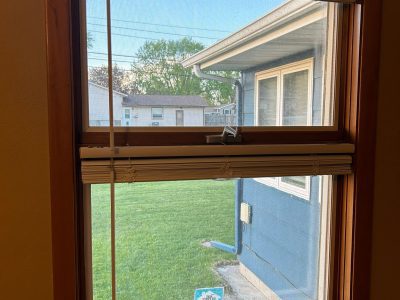 East Moline Window Installation - inside view brown Casement window, before