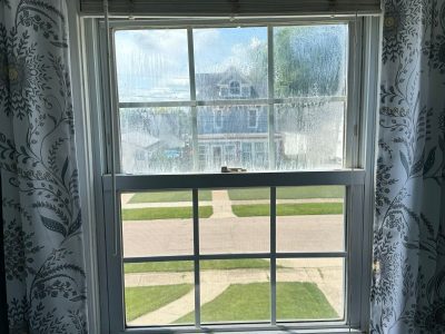 Kewanee Window Replacement - inside window more moisture, before