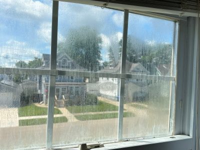 Kewanee Window Replacement - inside window moisture, before