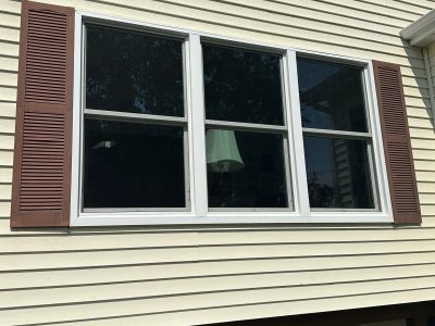 Le Claire Window Replacement - outside three double-hung windows, after