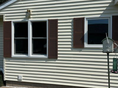 Le Claire Window Replacement - outside from backyard double-hung windows, after