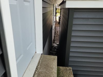 Eldridge Siding Replacement , between house and shed after