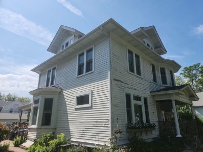 Davenport Siding Company - pealing corner wide view, before