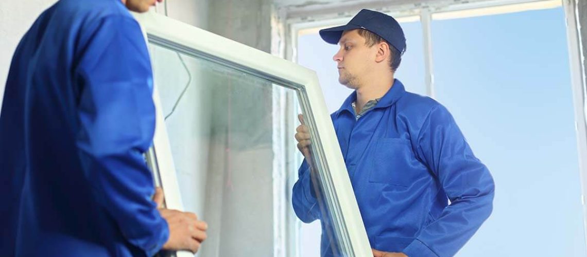 men installing replacement window in illinois