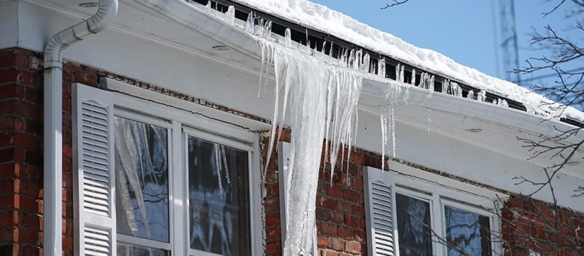 An ice dam forms and damages the gutters of a home in Bettendorf, IA.