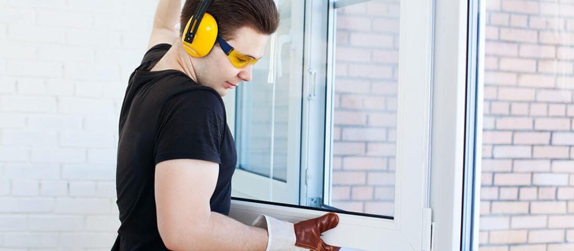 man installing slider windows in home remodel in Ashton IL