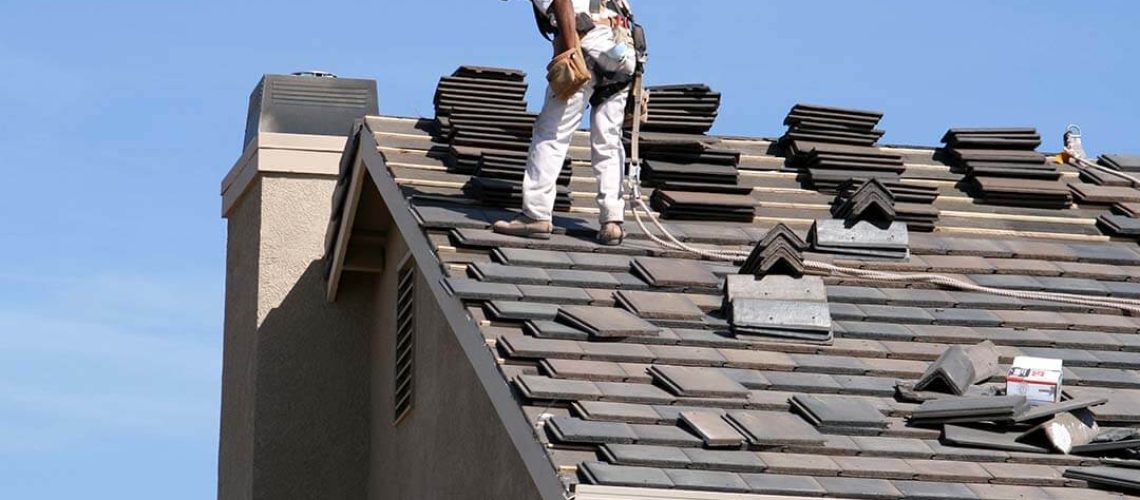 man replacing roof in home remolding in Davenport, IA