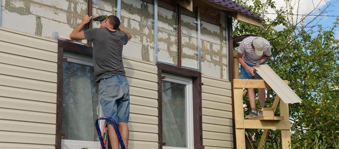 men installing new siding in home remodel in Quad City
